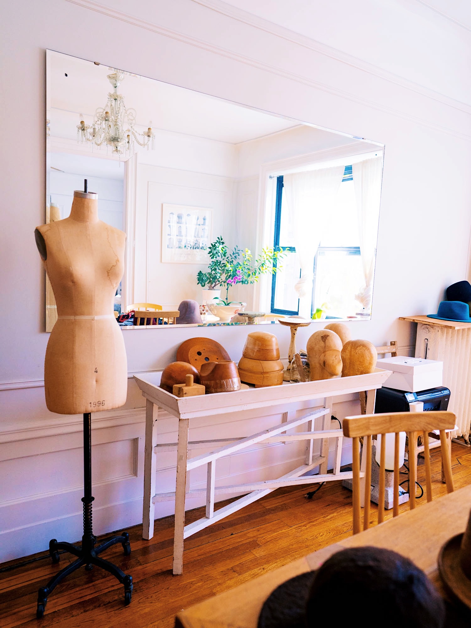 inside hat studio by karema deodato with her hat blocks