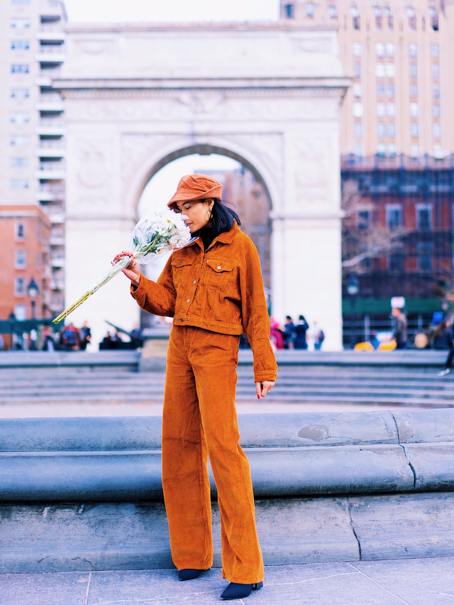 holiday party outfit idea look 3 with corduroy levi's trucker blazer pants sock booties and a bucket hats