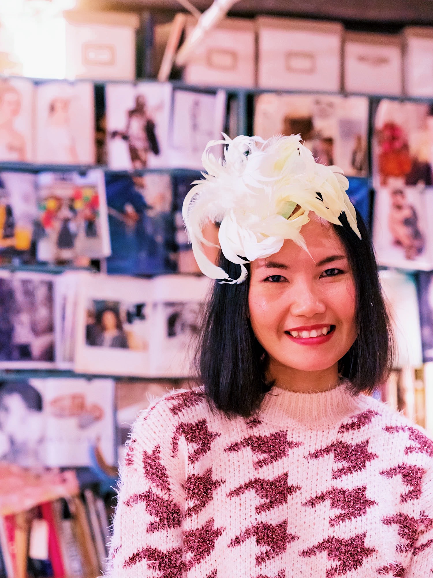 nanphanita that hat girl wearing bridal fascinator with hand painted feathers designed by ellen christine couture millinery nyc