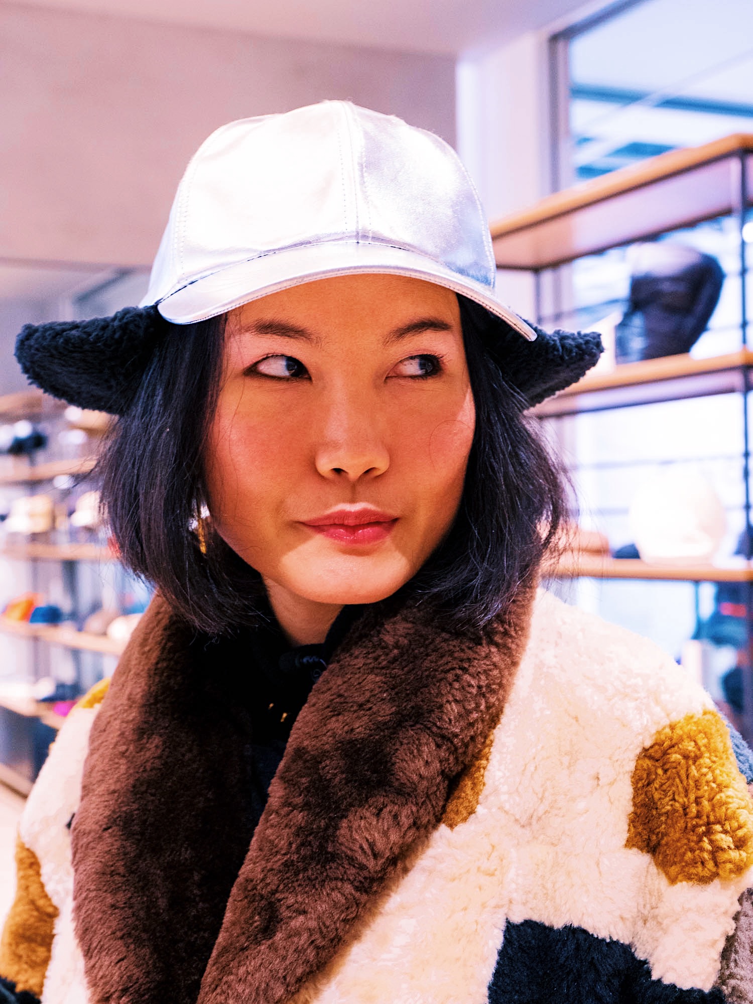 nanphanita #thathatgirl is wearing a unisex metallic cap by kijima takayuki tokyo