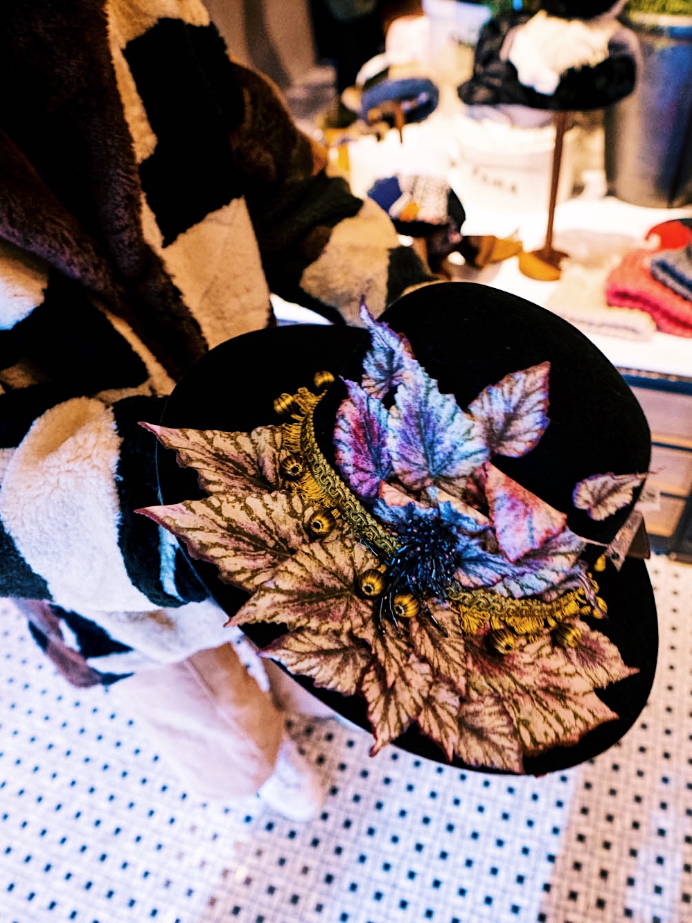 nanphanita visits ca4la show case a handmade hat with embellishments