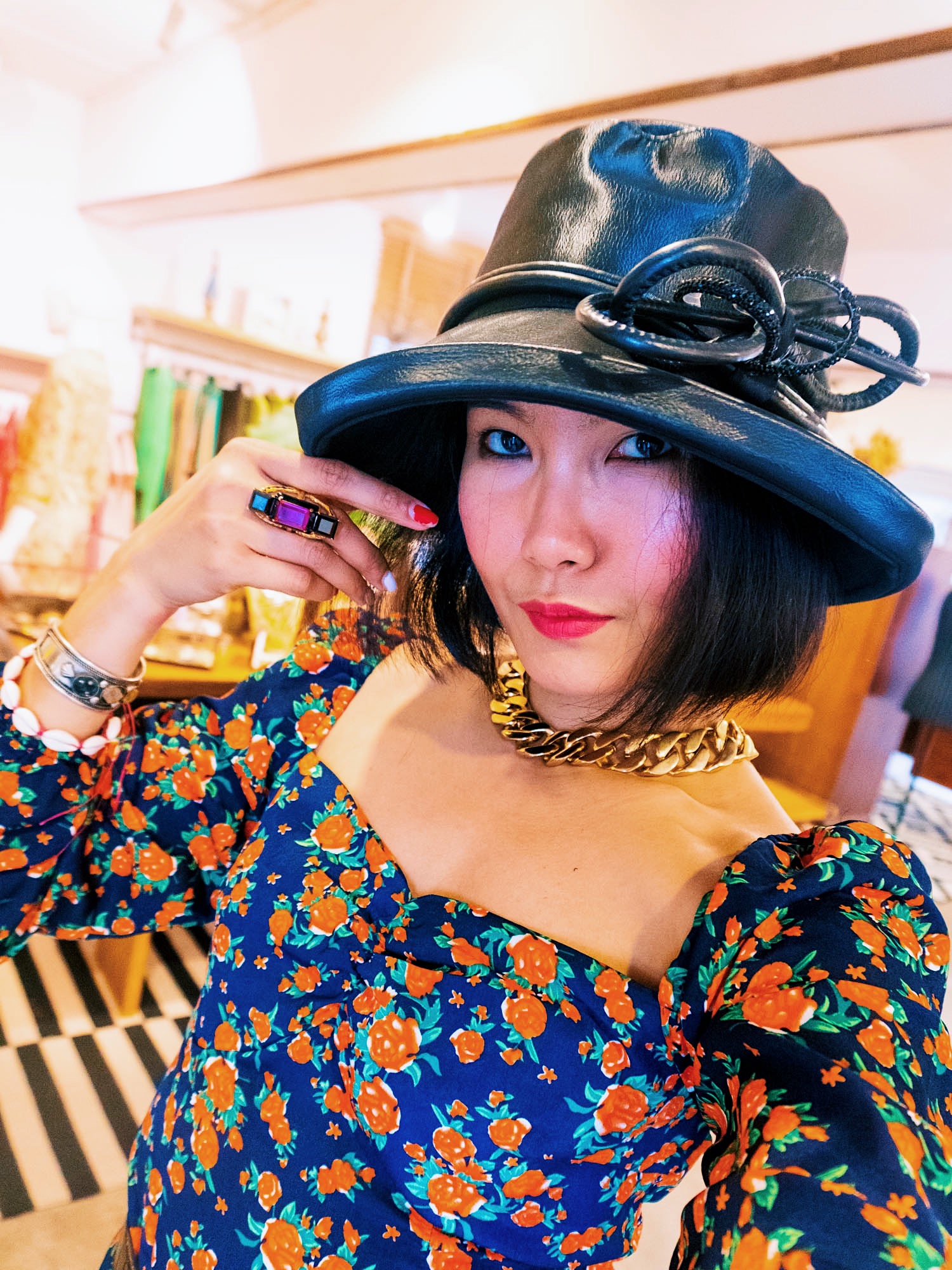 nanphanita is wearing a black leather bucket hat with black wire trim made by tete a porter bangkok