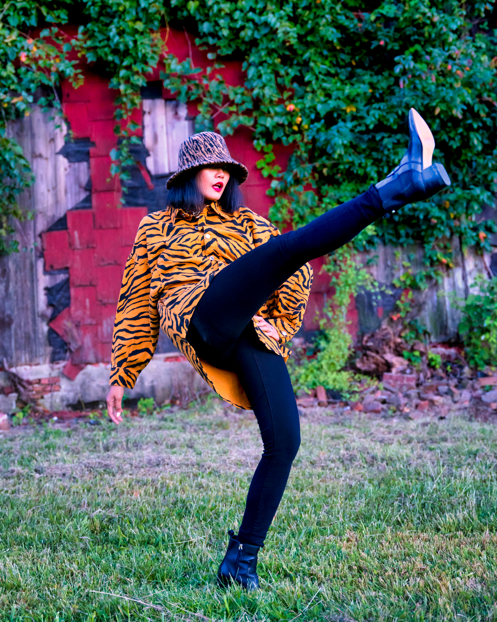 nanphanita jacob that hat girl is wearing a fuzzy and cozy tiger printed bucket hat from san diego hat company 2020 fall hat collection