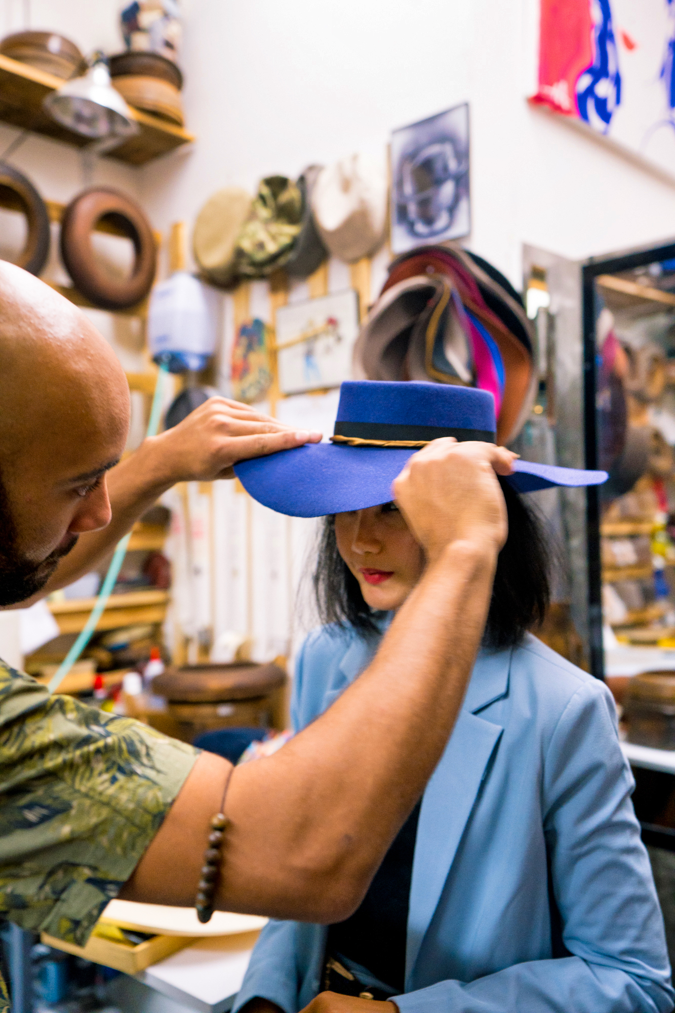 brandon franklin is working on a custom hat for nanphanita that hat girl