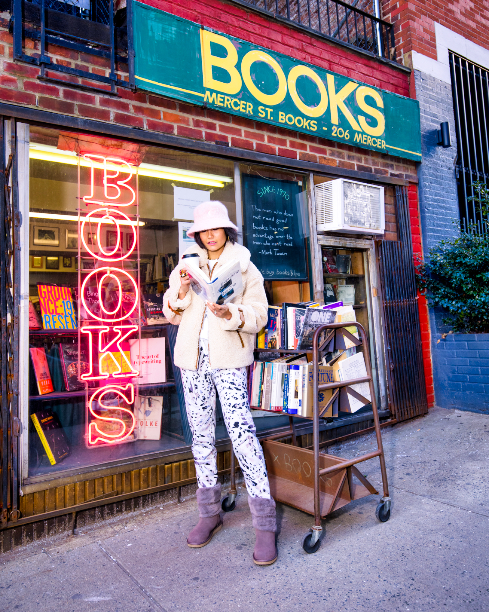 nanphanita jacob is wearing a kangol fiery dusty rose furgora bucket hat to a book store on mercer street nyc