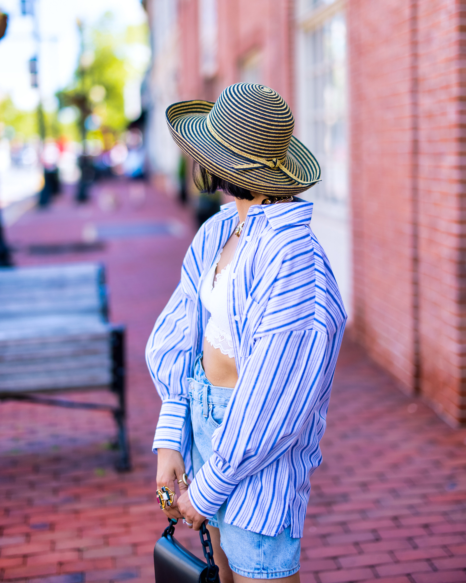 nanphanita jacob is showing the back of the stripe straw sunhat by san diego hat company and wandering at red bank new jersey